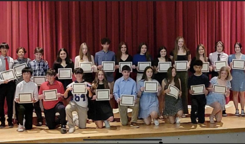 Group of students holding certificates.