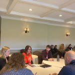 Staff and educators sitting at tables