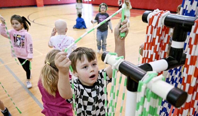 Elementary students in a school gym.