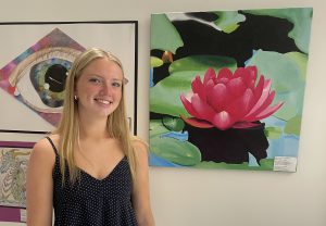 Mrs. Seymour's Drawing & Painting class went to the Legislative building in Albany to attend the 36th Annual New York State Art Teachers Association Legislative Student Art Exhibition. Olivia Dowd, shown here, was chosen to have work included in the show.